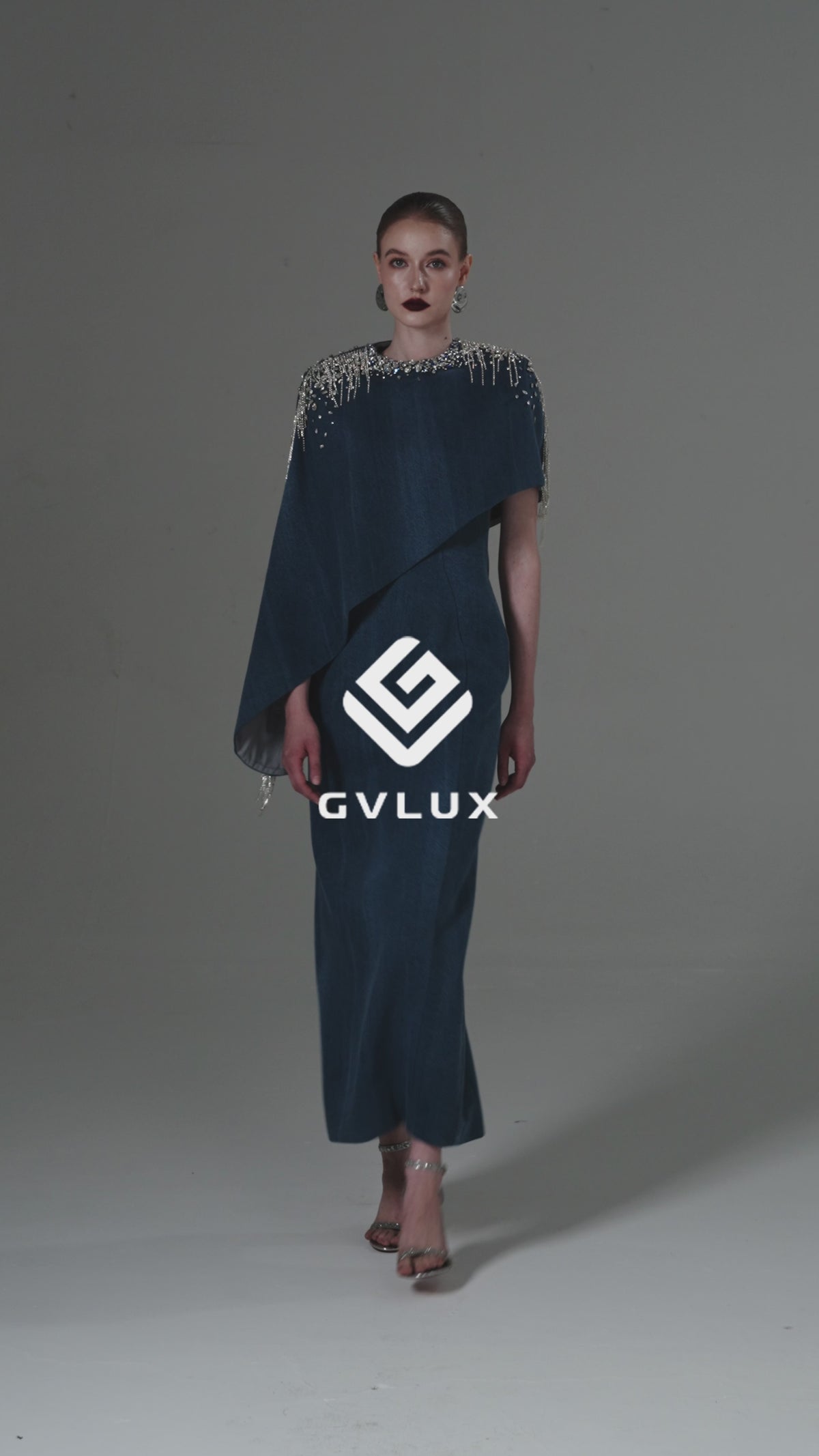 ASYMMETRICAL COLUMN DRESS WITH DRAPED CAPE SLEEVE IN BLUE