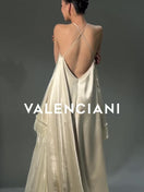 ROBE LONGUE PLISSÉE À COL HALTER CRÈME