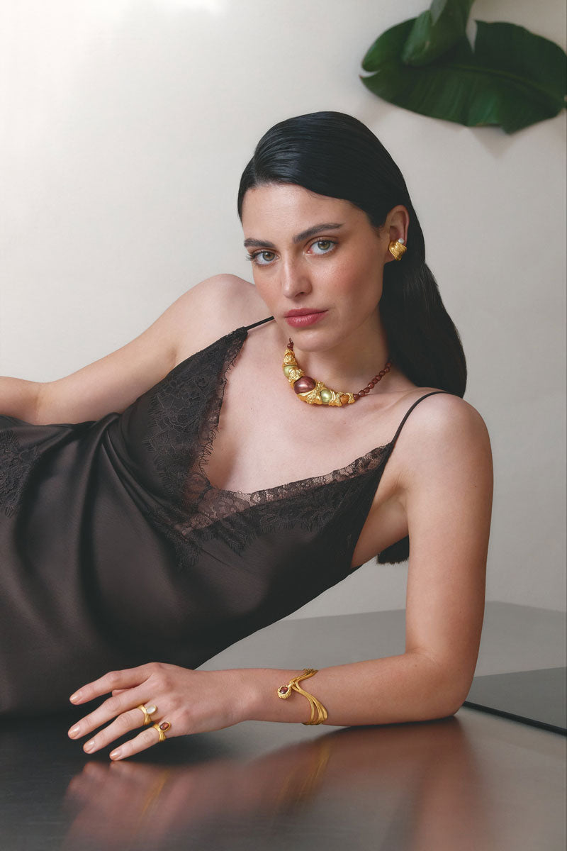 Gold and blue anchor ring by Jude Benhalim featuring a sleek design and nautical-inspired details.