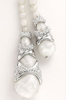 Jude Benhalim Cascade Necklace in white with layered chain design, stylish jewelry accessory, close-up shot.