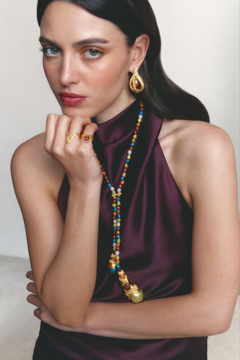 Gold drape ring by Jude Benhalim featuring elegant, flowing design, showcased on a neutral background.