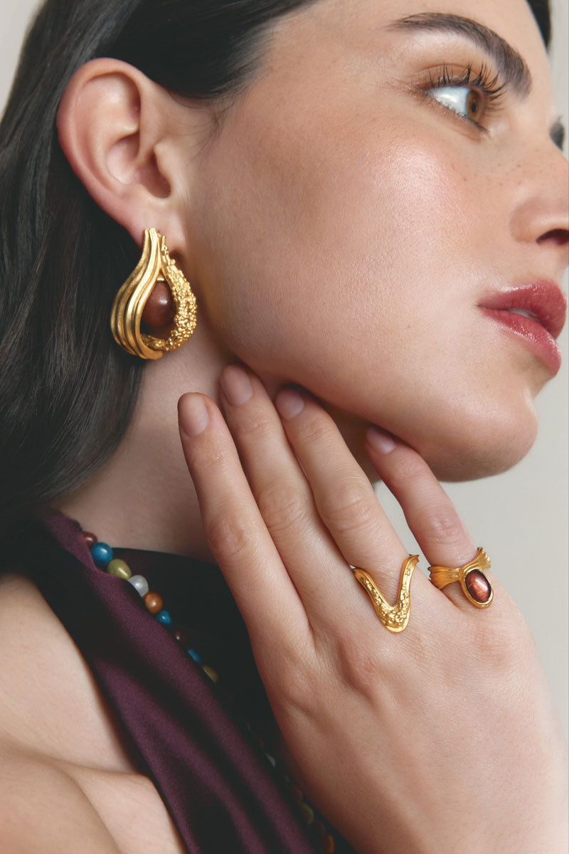 Gold drape ring by Jude Benhalim, showcasing elegant design with a sleek gold finish, perfect for stylish jewelry accessories.