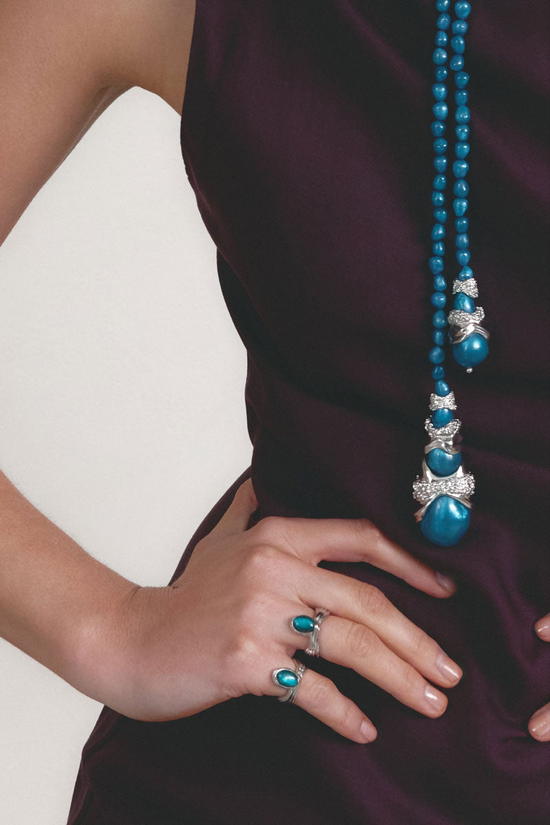 Silver and blue anchor ring by Jude Benhalim featuring a stylish anchor design on a polished silver band.