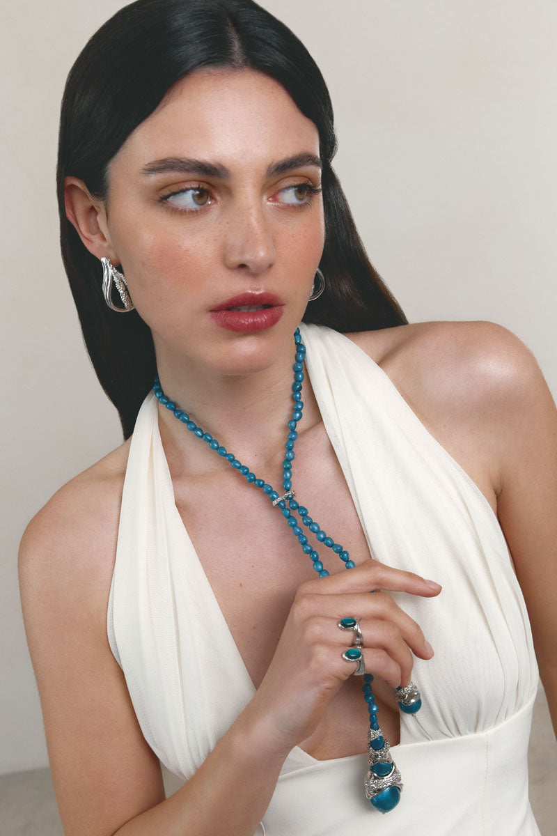 Silver and blue anchor ring by Jude Benhalim featuring a detailed anchor design on a sleek band.