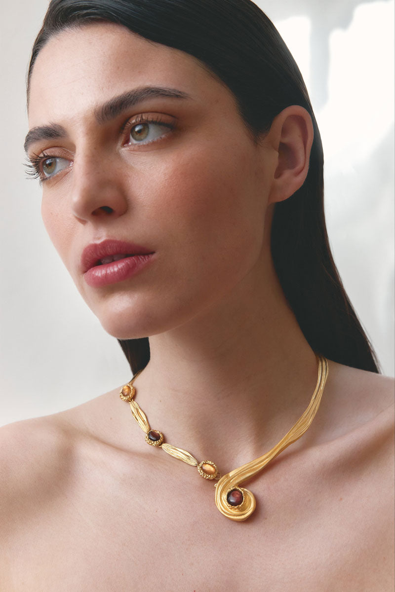 Gold interchangeable spirali necklace by Jude Benhalim with multiple spiral pendants on a delicate chain.