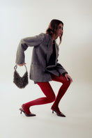 Silver top handle bag by Millanne Tale featuring metallic finish and stylish design, ideal for fashionable accessories.