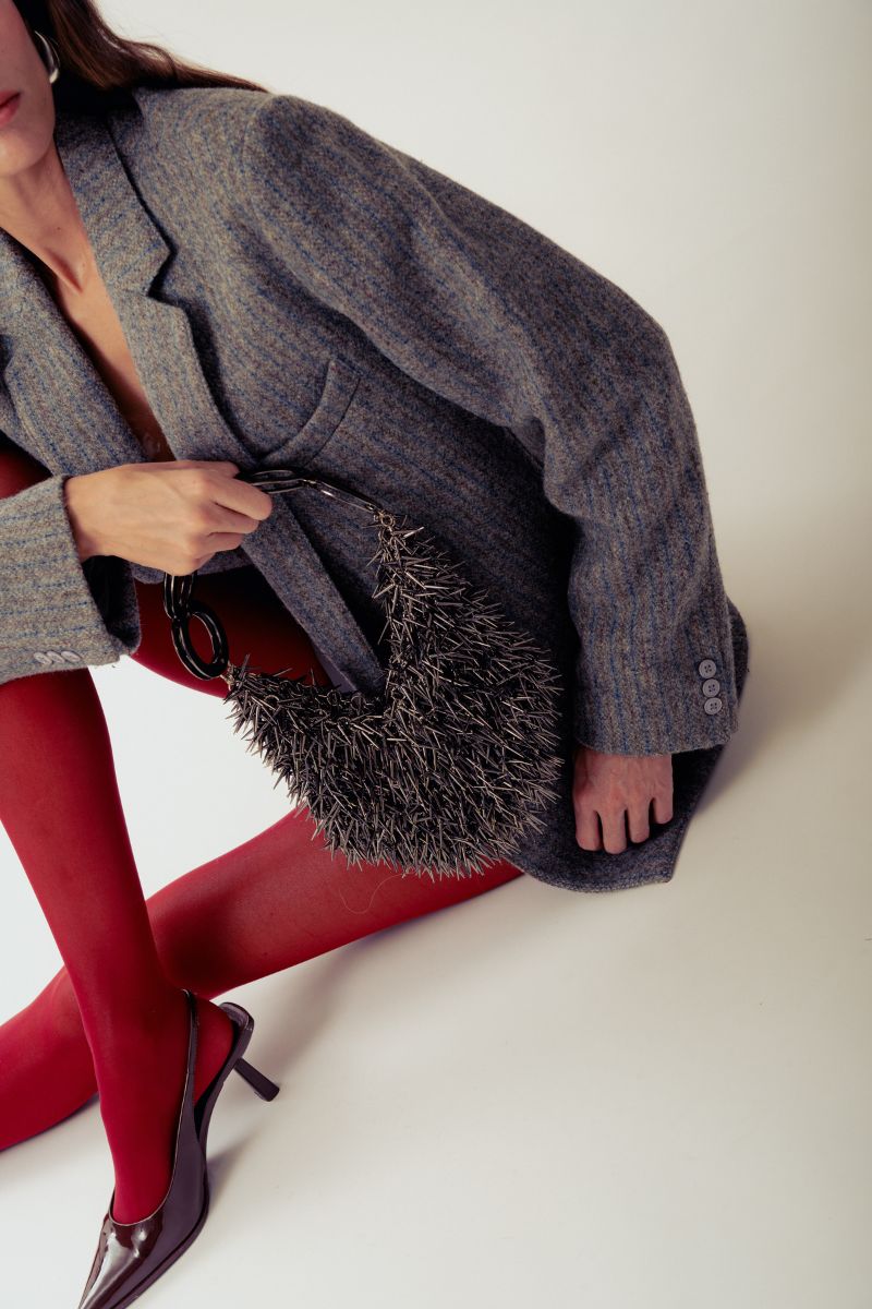 Gray Punka Silver Top Handle Bag by Millanne Tale featuring a metallic punk-inspired design and sturdy handle.