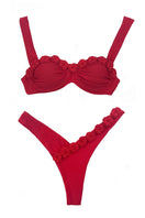 Señorita Sariera bikini with vibrant patterned fabric and classic bikini top and bottom, suitable for beach and swimwear.