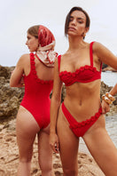 Red Señorita Satuna swimsuit with stylish design, fitted silhouette, and adjustable straps, perfect for swimming or beachwear.