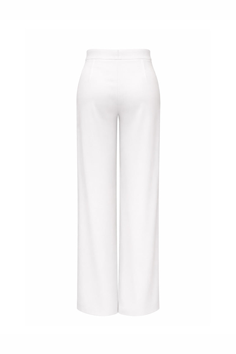 White Reine pants by Gigii's displayed with a focus on the tailored fit and fabric texture.