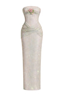 Elegant ivory gown by HACCHIC COUTURE featuring a draped corset design with sequin embellishments, styled for formal occasions.