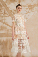 Rosee de Matin Yasmine A-line short-sleeved lace midi dress, elegant and feminine with intricate lace details and a flattering silhouette.