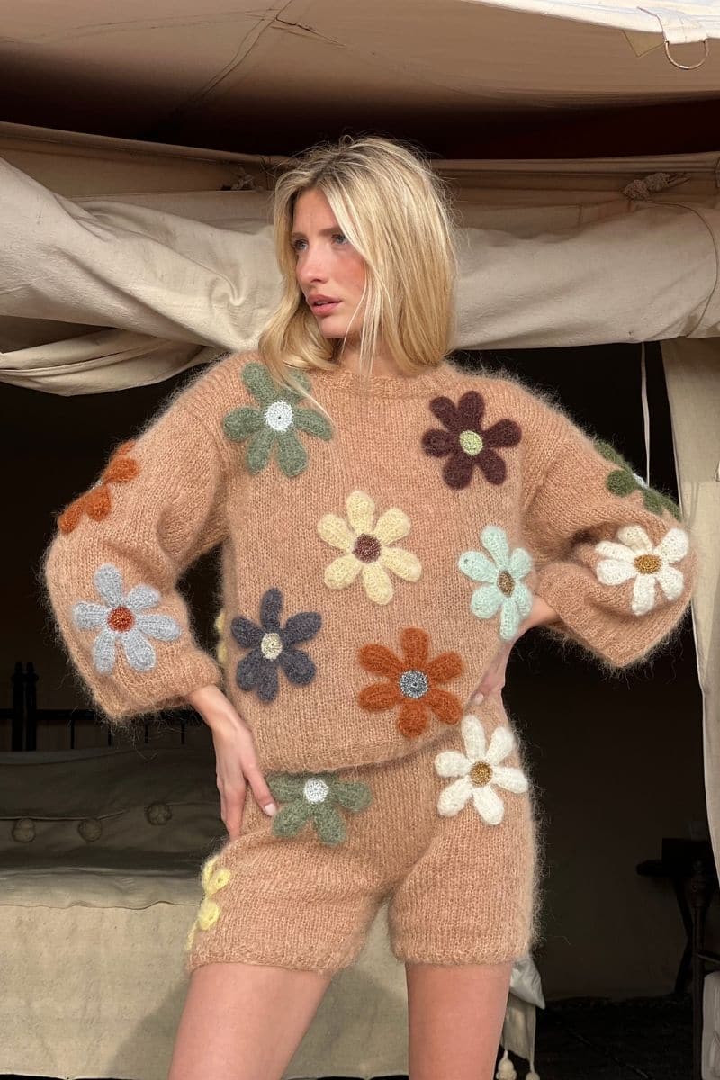 Beige Rose Carmine free flowers pull sweater with a relaxed fit, featuring floral knit pattern and ribbed cuffs and hem.