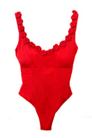 Señorita Satuna swimsuit in vibrant colors, featuring a stylish one-piece design with cut-out details, perfect for beachwear.