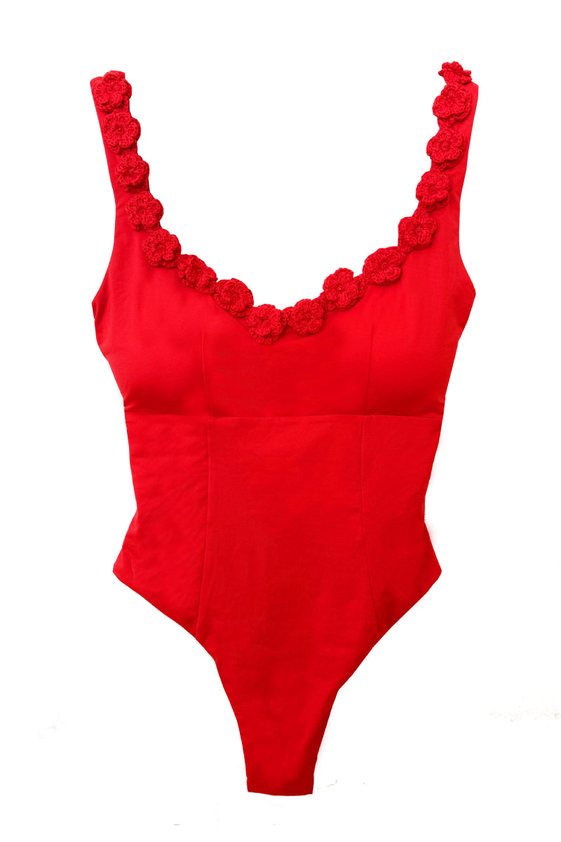 Señorita Satuna swimsuit in vibrant colors, featuring a stylish one-piece design with cut-out details, perfect for beachwear.