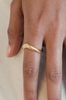Gold sand ring by EDXÚ featuring a textured, matte finish, perfect for elegant jewelry styling and everyday wear.