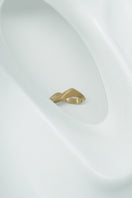 Matte gold sand ring by EDXÚ featuring a textured, natural-inspired design, styled on a model's finger.