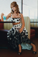 Scarlett Gasque Fiorella Dot Midi Skirt featuring a flowy fabric and stylish polka dot pattern on a neutral background.