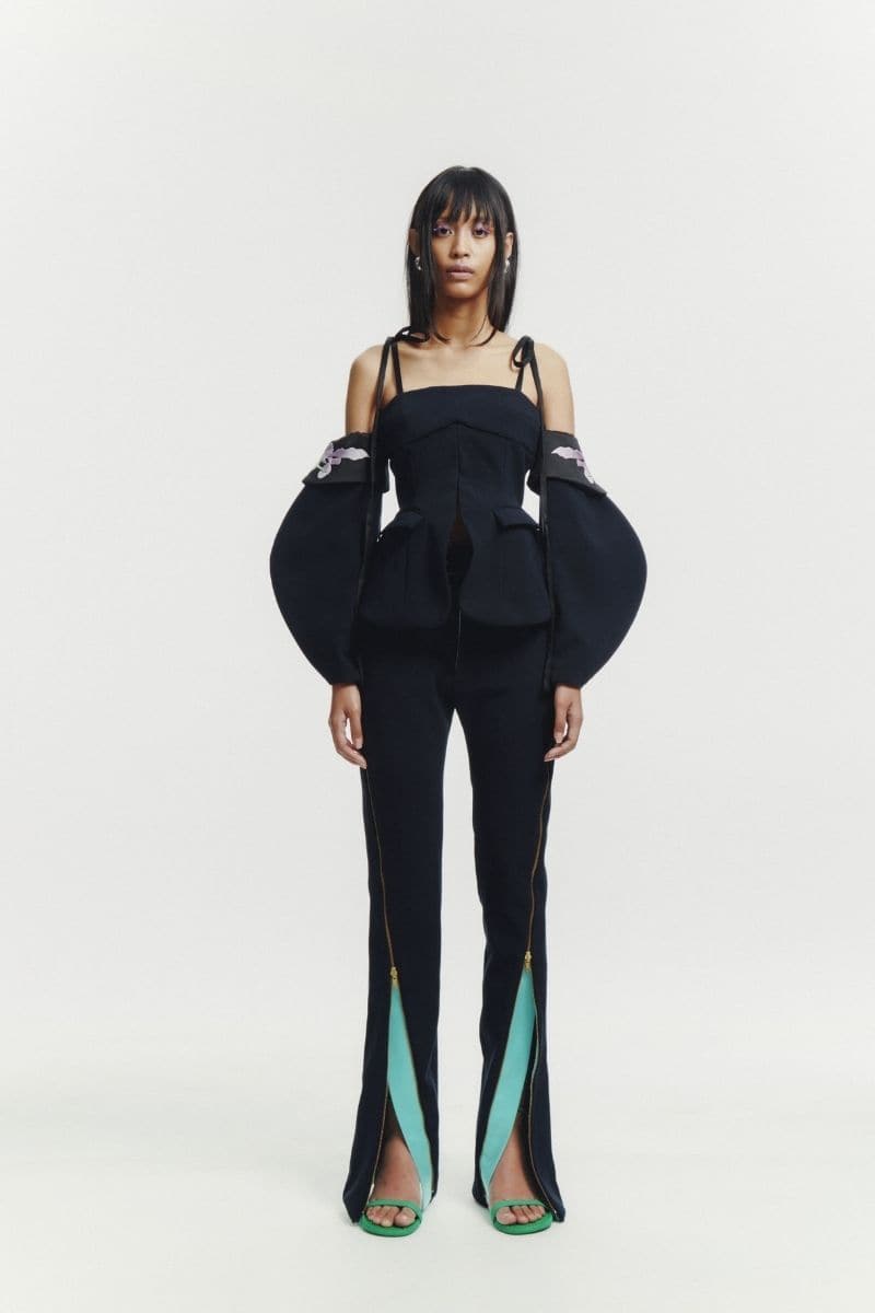 Black embroidered tailored top by Sean Sheila, featuring intricate embroidery and a structured fit, designed for stylish wear.