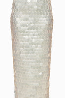 Close-up of a white sequin maxi skirt by Balykina, showing shimmering sequins and flowing fabric detail.