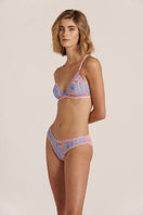 Sheer pink lingerie set with a bralette and thong from Luciela, featuring delicate, semi-transparent fabric and feminine design.