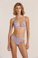 Sheer pink lingerie set featuring a bralette and thong from Luciela, with delicate floral details and lightweight, transparent fabric.