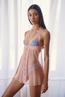 Sheer pink mesh Poppy baby doll from Luciela, featuring delicate lace details and soft, flowing fabric for a feminine look.