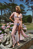 Sheer pink mesh robe by Luciela, lightweight and stylish, displayed hanging with soft fabric folds and delicate texture.