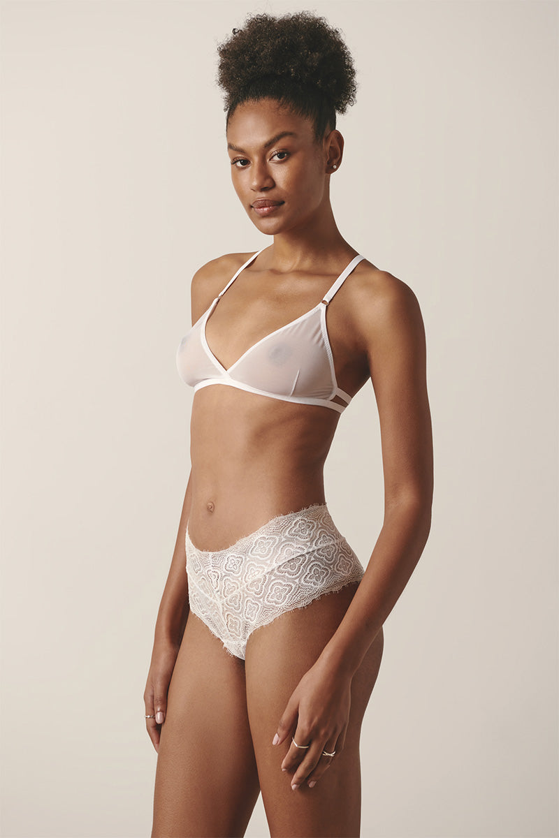Sheer white lingerie set featuring a delicate bralette and matching boyshorts from Luciela.