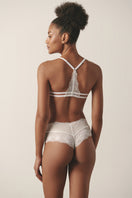 Sheer white bralette and matching white boyshort lingerie set by Luciela, featuring delicate lace details and comfortable fit.