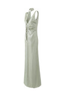 Aisl green pleated V-neck gown shown from the side, featuring elegant fabric and flowing design for formal occasions.