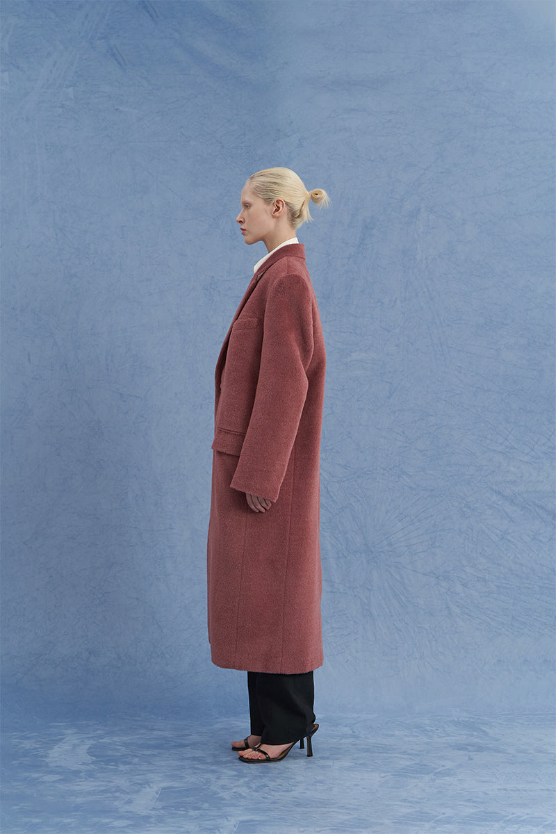 JINSUN oversized pink Suri alpaca coat shown from the side, featuring a plush, cozy design and wide fit for stylish comfort.