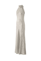 Aisl champagne halter maxi dress with matching scarf, side view showcasing elegant flowy fabric and stylish design.