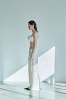 JINSUN ivory Pappus Tweed Maxi Skirt shown from side view, featuring a textured tweed fabric and flowing silhouette.