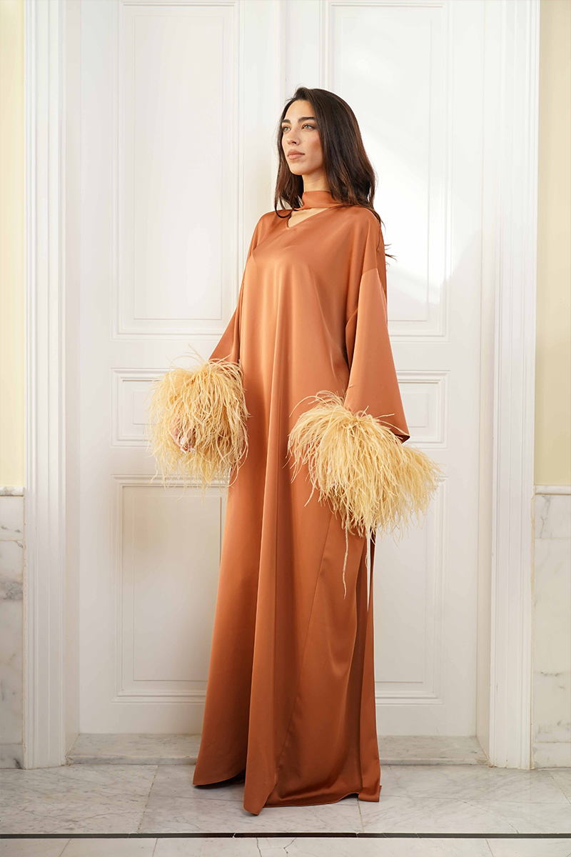 Joanna Andraos CULT MIA X Joanna Andraos Amber Silk-Effect Gown shown from the side, flowing and elegant fabric with a sleek silhouette.