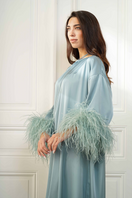 Side close-up of Joanna Andraos Cult Mia X gown featuring a tie-neck and feather-sleeve silk design.