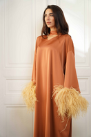Close-up of the CULT MIA X Joanna Andraos Amber Silk-Effect Gown showing elegant fabric texture and side silhouette detail.