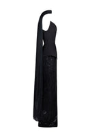 Black embroidered corset set by Joanna Andraos, featuring intricate embroidery and fitted design, shown from a side angle.