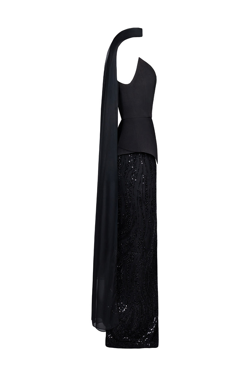 Black embroidered corset set by Joanna Andraos, featuring intricate embroidery and fitted design, shown from a side angle.