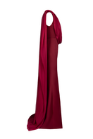 Side view of Joanna Andraos burgundy one-shoulder cape gown with elegant draping and flowing fabric.