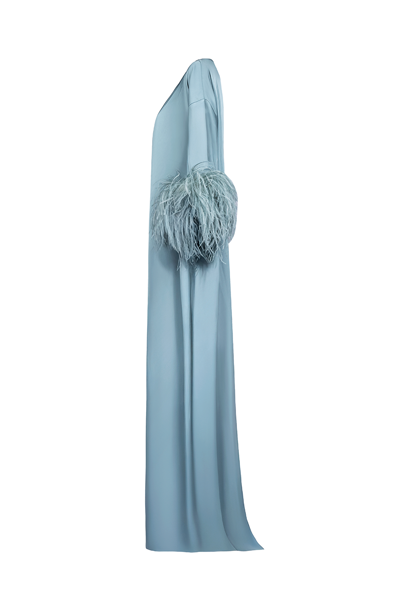 Joanna Andraos feather-sleeve silk gown with tie-neck design, shown from side view in elegant black fabric.