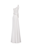 White corset top and palazzo trouser co-ord set by Joanna Andraos, shown from a side angle.