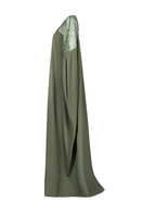 Olive green embroidered gown by Joanna Andraos, featuring intricate embroidery and flowing fabric, shown from a side view.