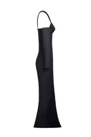 Joanna Andraos black gown with detachable sleeves, elegant side view showing flowing fabric and stylish design details.