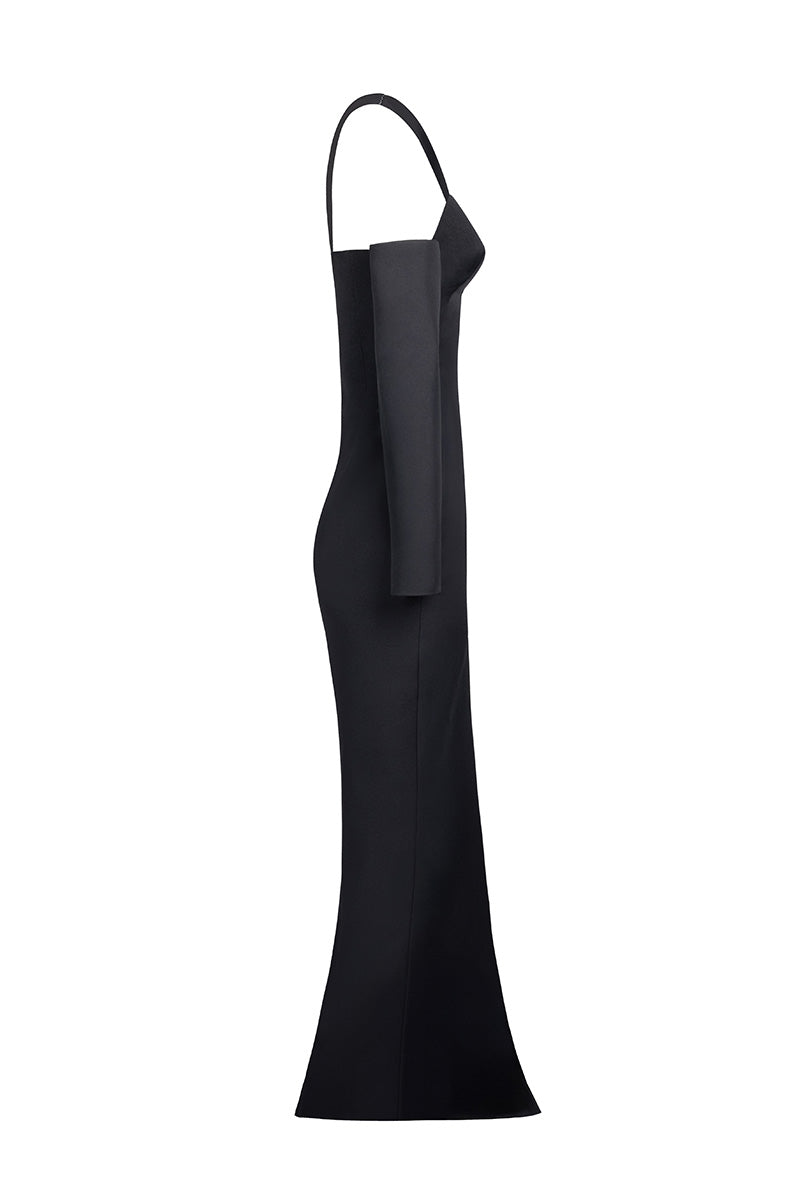Joanna Andraos black gown with detachable sleeves, elegant side view showing flowing fabric and stylish design details.