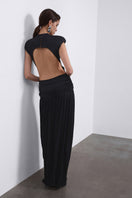 Black SIRA draped open-back maxi dress by SÉLONE, featuring flowing fabric and elegant draping detail.