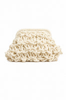 Small rope clutch bag in egg white from Folklore The Label, featuring a compact design with a textured rope material.