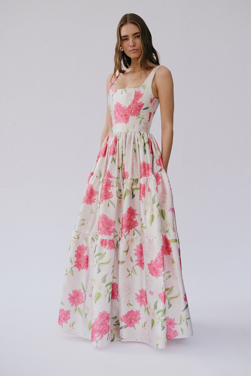 Gigii's Sophia floral maxi dress displayed with a flowing silhouette and vibrant floral pattern on soft fabric.