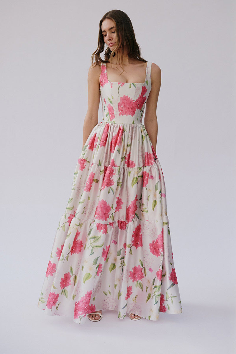 Gigii's Sophia floral maxi dress featuring a flowy silhouette and vibrant floral pattern, perfect for summer occasions.
