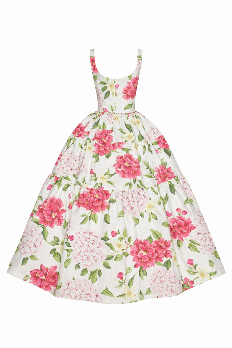 Gigii's Sophia floral maxi dress displayed on a hanger, featuring a vibrant, flowy design with a fitted waist and lightweight fabric.